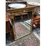 A RECTANGULAR MIRROR WITHIN STRIPS OF MIRROR AND A GILT CLASSICAL FRAME. 92 x 65cms.