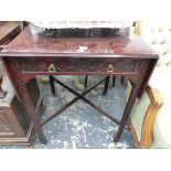 A GEORGE III STYLE MAHOGANY PEMBROKE TABLE WITH BLIND FRET CARVING ON THE DRAWER AND LEGS ON BRASS