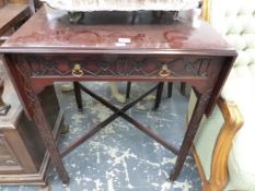 A GEORGE III STYLE MAHOGANY PEMBROKE TABLE WITH BLIND FRET CARVING ON THE DRAWER AND LEGS ON BRASS