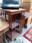 AN EDWARDIAN MAHOGANY ROTARY BOOK CASE