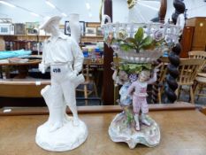 A ROYAL WORCESTER WHITE PORCELAIN LAMP BASE, TOGETHER WITH A GERMAN PORCELAIN FIGURAL BASKET ON