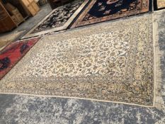 A PERSIAN KASHAN CARPET. 388 x 270cms