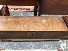 AN 18th C. ELM COFFER WITH PLANK SIDES AND FRONT, THE INTERIOR WITH A CANDLE BOX. W 133 x D 38 x H