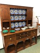 A LARGE ANTIQUE OAK POT BOARD DRESSER AND PLATE RACK.