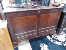 AN 18th C. OAK MULE CHEST, THE TWO PANEL FRONT BANDED IN MAHOGANY ABOVE TWO DRAWERS AND BRACKET