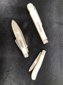 TWO MOTHER OF PEARL AND SILVER FRUIT KNIVES AND A SIMILAR PICNIC FORK.