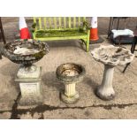 TWO COMPOSITE BIRD BATHS AND A CLASSICAL STYLE URN ON STAND