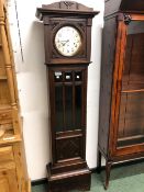 AN EARLY 20th C. OAK LONG CASE CLOCK.