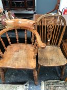 A SMOKERS BOW CHAIR TOGETHER WITH AN OAK WHEEL BACK KITCHEN CHAIR