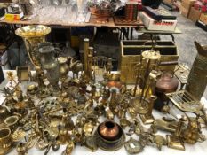 BRASS WARES, TO INCLUDE: FIRE ACCESSORIES, CANDLESTICKS, A MAGAZINE RACK, HAND BELLS, VASES.