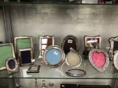 A COLLECTION OF THIRTEEN SILVER AND OTHER ELECTROPLATE PHOTOGRAPH FRAMES
