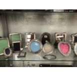 A COLLECTION OF THIRTEEN SILVER AND OTHER ELECTROPLATE PHOTOGRAPH FRAMES