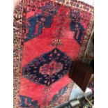 A TRIBAL ORIENTAL SMALL CARPET. 322 x 208cms