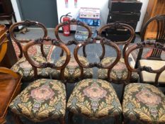 A SET OF FOUR AND A PAIR OF VICTORIAN ROSEWOOD BALLOON BACKED CHAIRS