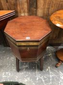 A GEORGE III BRASS BOUND MAHOGANY TWO HANDLED OCTAGONAL CELLARETTE WITH A LEAD LINED LIFT OUT