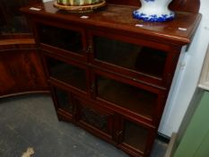 A LATE VICTORIAN MAHOGANY BOOKCASE, THE TOP TWO SHELVES ENCLOSED BY PAIRS OF GLAZED DOORS, THE