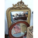 A VICTORIAN GILT FRAMED RECTANGULAR MIRROR. 119 x 74cms. TOGETHER WITH A MAHOGANY FRAMED CIRCULAR