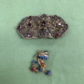 AN EASTERN SILVER GILT AND GEMSET BELT BUCKLE CONVERTED AS A BROOCH, TOGETHER WITH A SILVER GILT AND