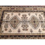 A MACHINE MADE CARPET OF PERSIAN DESIGN. 290 x 204cms