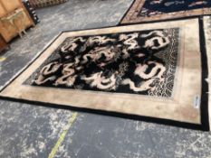 A CHINESE DRAGON DESIGN CARPET. 380 x 277cms