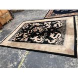 A CHINESE DRAGON DESIGN CARPET. 380 x 277cms