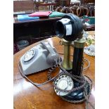 A STICK TELEPHONE TOGETHER WITH A TWO TONE MUSHROOM COLOURED TELEPHONE