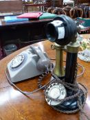 A STICK TELEPHONE TOGETHER WITH A TWO TONE MUSHROOM COLOURED TELEPHONE