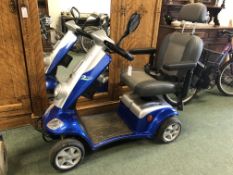 A KYMCO MOBILITY SCOOTER.