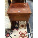 AN EDWARDIAN MAHOGANY WORK TABLE, THE HINGED LIDS LINE INLAID WITH OVALS AND MEETING CENTRALLY