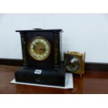 A BLACK SLATE CASED TIMEPIECE, TOGETHER WITH A BATTERY OPERATED CLOCK