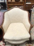 A 19th C. MAHOGANY SHOW FRAME ARMCHAIR, THE UPHOLSTERED BACK CRESTED BY CARVED SWAGS ABOVE BEADED