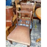 A LATE VICTORIAN MAHOGANY NURSING CHAIR TOGETHER WITH A CANED BACKED SIDE CHAIR