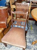 A LATE VICTORIAN MAHOGANY NURSING CHAIR TOGETHER WITH A CANED BACKED SIDE CHAIR