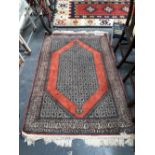 AN ORIENTAL PART SILK RUG OF PERSIAN DESIGN. 180 x 116cms