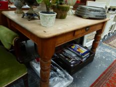 A PINE TABLE WITH A DRAWER TO ONE LONG SIDE ABOVE TURNED LEGS. W 121 x D 85 x H 73cms.