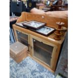 A PINE DRESSER BACK WITH A GALLERIED SHELF OVER SLIDING GLASS DOORS. W 104 x D 35 x H 83cms