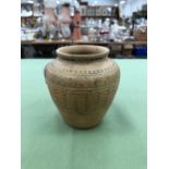 A SMALL POTTERY VASE.