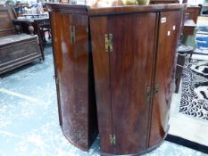 TWO 19th C. MAHOGANY BOW FRONTED CORNER CUPBOARDS. W 72 x H 102cms. AND W 68 x H 101cms.