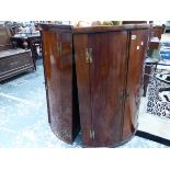 TWO 19th C. MAHOGANY BOW FRONTED CORNER CUPBOARDS. W 72 x H 102cms. AND W 68 x H 101cms.