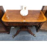 A GEORGE III CROSS BANDED BURR WOOD GAMES TABLE, THE TOP SWIVELLING OPEN TO REVEAL GREEN BAIZE,