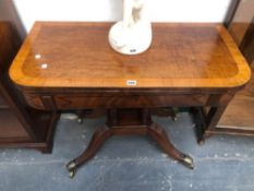 A GEORGE III CROSS BANDED BURR WOOD GAMES TABLE, THE TOP SWIVELLING OPEN TO REVEAL GREEN BAIZE,