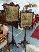 A PAIR OF VICTORIAN WALNUT POLE SCREENS, THE SCROLL RECTANGULAR FRAMED BANNERS WITH BIRD AND