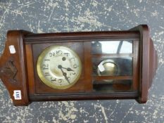 A VINTAGE WALL CLOCK.