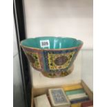 A CHINESE HEXAFOIL BOWL WITH TURQUOISE INTERIOR AND ALTERNATING FAMILLE ROSE YELLOW GROUND PANELS ON