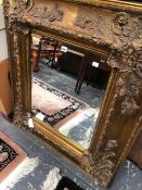 A RECTANGULAR MIRROR WITHIN A MODERN GILT FRAME. 99 x 88cms.