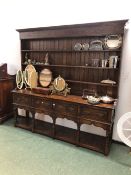 A LARGE 18th C. STYLE OAK POT BOARD DRESSER BASE AND ASSOCIATED PLATE RACK.