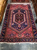 A PERSIAN TRIBAL RUG. 217 x 134cms