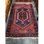 A PERSIAN TRIBAL RUG. 217 x 134cms