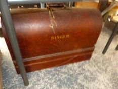 A VINTAGE SINGER SEWING MACHINE IN CARRY CASE.