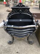 AN ANTIQUE STYLE CAST IRON FIRE BASKET.